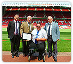 Arnold being presented with the FCSI Award at Old Trafford